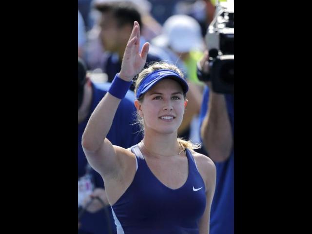 Eugenie Bouchard of Canada waves after defeating Olga Govortsova of Belarus (AFP Photo)