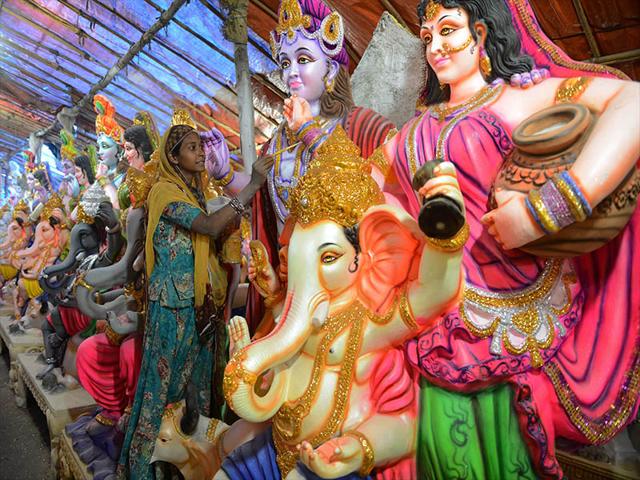 An Indian artists gives the final touches to a statue of the Hindu god Lord Ganesh ahead of the forthcoming Ganesh Chaturthi festival in Hyderabad. The statues are being prepared for the Ganesh festival, a popular eleven-day long Hindu religious festival in India which will be celebrated from August 29 to September 8. (AFP PHOTO/Noah Seelam)