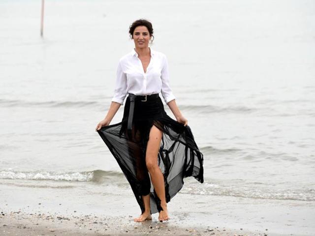 Italian actor Luisa Ranieri, the godmother of the 71st Venice Film Festival, poses during a photocall on August 26, 2014 on the eve of the opening ceremony of the festival at Venice Lido. (AFP)