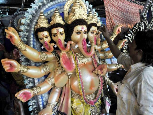 As Ganesh Chaturthi begins, artists are busy giving finishing touches to Ganpati idols, in Bhopal. (Praveen Bajpai/HT photo)