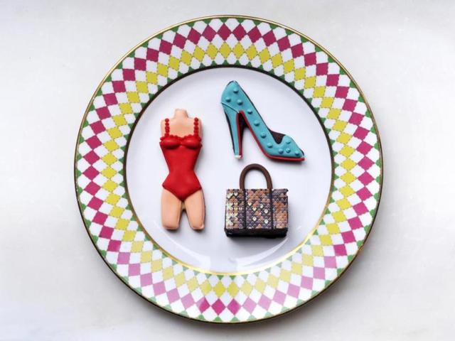 Cakes, pastries, and cookies are given a runway makeover, inspired by the designs of luxury brands like Christian Louboutin, Miu Miu, DSquared, Victoria Beckham and Oscar de la Renta. Louboutin’s Pigalle, the brand's classic patent pump, for instance, has been turned into an edible cookie with turquoise icing and its signature red sole, while chefs paid homage to Miu Miu by replicating the brand's exotic skin tote bag with chocolate pecan moelleux.The Pret-a-Portea Jimmy Choo Collection service runs October 13 - 19. Both services are £41 (about US$68).