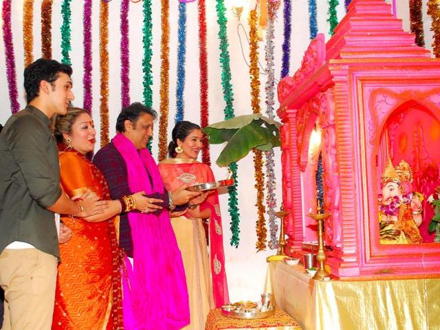 Star of the '90s, Govinda with his wife Sunita and son Yashowardan daughter Narmada during the Ganesh Chaturthi celebrations at his residence in Mumbai on August 29, 2014. (IANS)