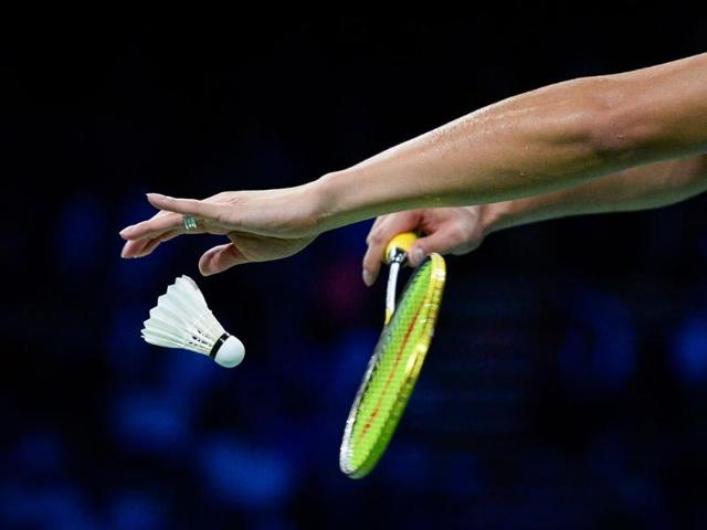 China's Xu Chen serves a ball while competing with China's Ma Jin against Denmark's Joachim Fischer Nielsen and Christinna Pedersen during the mixed double semi final match at the 2014 BWF Badminton World championships, in Copenhagen . (AFP Photo)