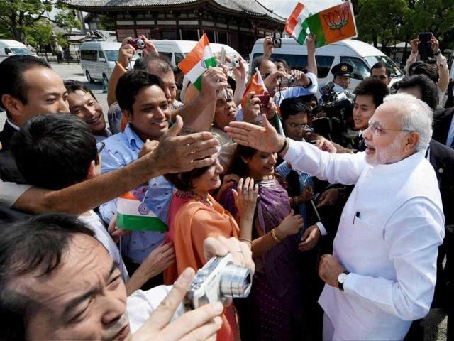 PM Modi, interacts with people including people of India origin during his visit in Toji Temple in Kyoto. (PTI Photo)