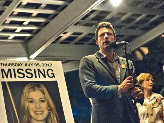 Ben-Affleck-Lisa-Barnes-and-David-Clennon-in-a-scene-from-Gone-Girl-The-film-based-on-the-best-selling-novel-will-release-on-October-3-in-America-AP