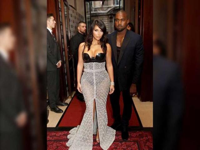 Kim and Kanye West at an award event. Kim donned a Ralph & Russo Couture silver and black gown, which featured a latex body suit and a chainmail style maxi skirt with a large slit down the front. (Kim Kardashian Instagram)
