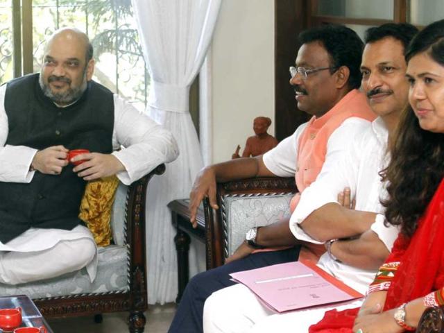 BJP-president-Amit-Shah-met-the-state-s-party-workers-at-party-leader-Vinod-Tawde-s-residence-in-Mumbai-Elections-are-due-next-month-in-Maharashtra-Satish-Bate-HT-photo