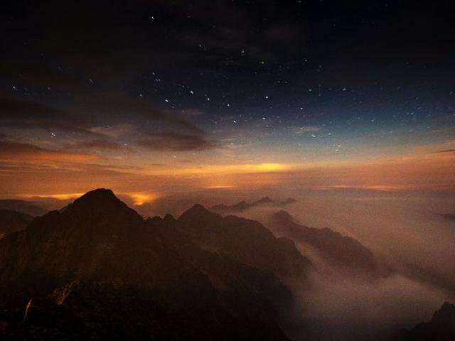 Slovakia, Lomnicky Stit: September 04, 2014 A long time exposed picture taken by night shows Slovakia's High Tatras mountains seen from the Solar observatory station on the Lomnicky Stit peak. (AFP/Joe Klamar)