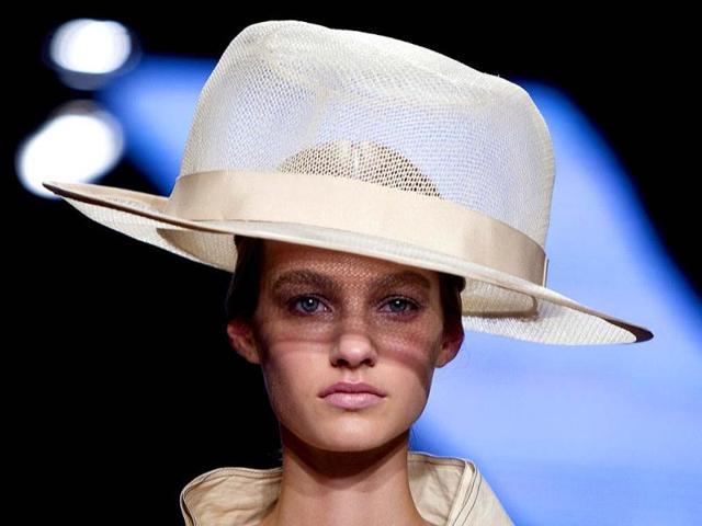 A model presents a creation during the Donna Karan show, where much of the whimsy came in the bold colors, the lively prints, and the truly unusual - OK, downright bizarre, but fun - hats by milliner Stephen Jones. (Reuters)