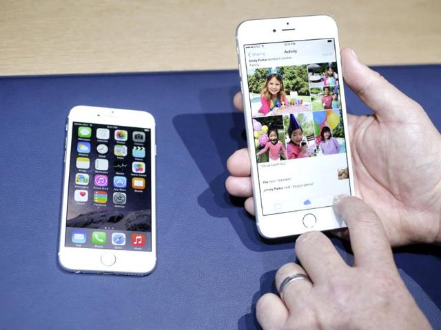 The iPhone 6, at left, and iPhone 6 plus are shown next to each other during a new product release. (AP Photo)