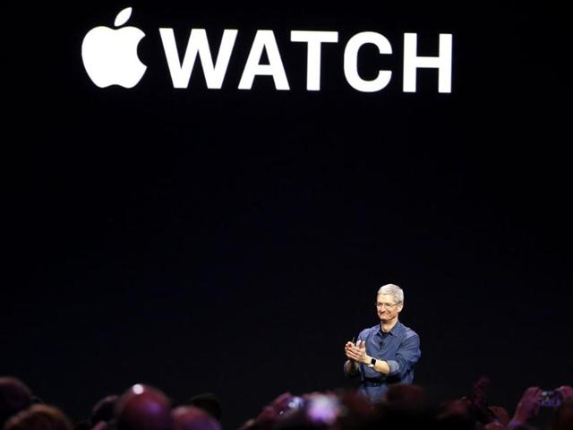 Apple CEO Tim Cook applauds as he unveils the Apple Watch during an Apple event at the Flint Center in Cupertino, California. (Reuters Photo)