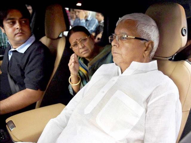 RJD chief Lalu Prasad leaves Asian Heart Hospital with his wife Rabri Devi after going through a triple cardiac surgery in Mumbai. (PTI photo)