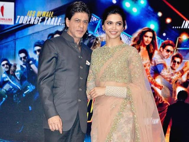 Shah Rukh Khan and Deepika Padukone strike a pose at the music launch of Happy New Year.