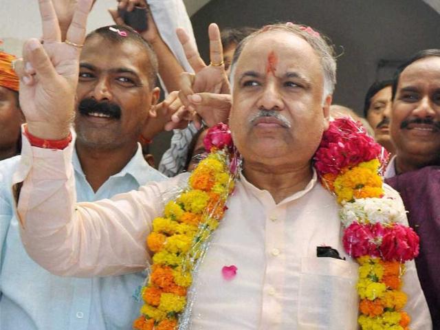 BJP candidate and senior leader Lalji Tandon's son Ashutosh Tandon flashes victory sign after winning the Lucknow East assembly seat in Lucknow. (PTI Photo)