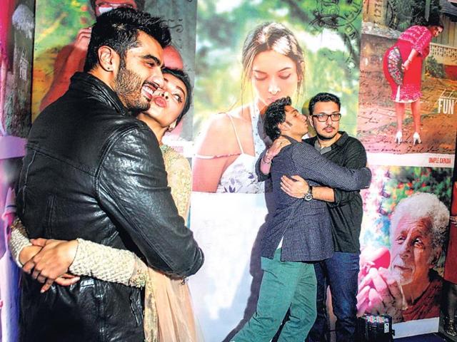 Ranveer Singh finds solace in Dinesh's hugs even as Deepika pretends to kiss Finding Fanny co-star Arjun Kapoor.