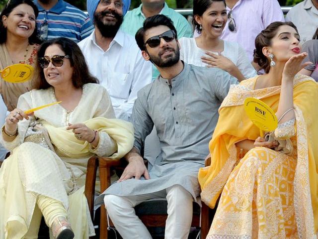 Actors Kirron Kher, Fawad Khan and Sonam Kapoor with BSF personnel during a promotional event of their upcoming film Khoobsurat at Attari international border. (IANS)