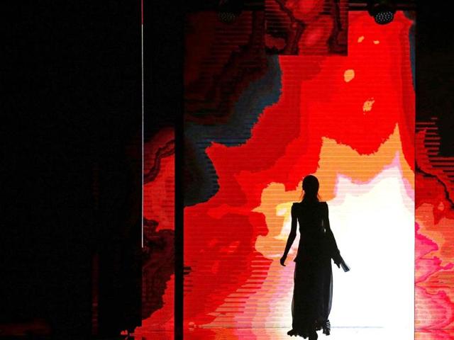 A model is silhouetted on the catwalk while presenting a creation from the Just Cavalli Spring/Summer 2015 collection during Milan Fashion Week. (Reuters Photo)