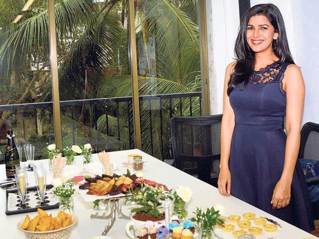 Wondering if Nimrat Kaur was going to go gobble up all that’s served on the table? Not really. The actor was caught on camera while just checking out the food menu at a Mumbai event. (Photo: Yogen Shah)