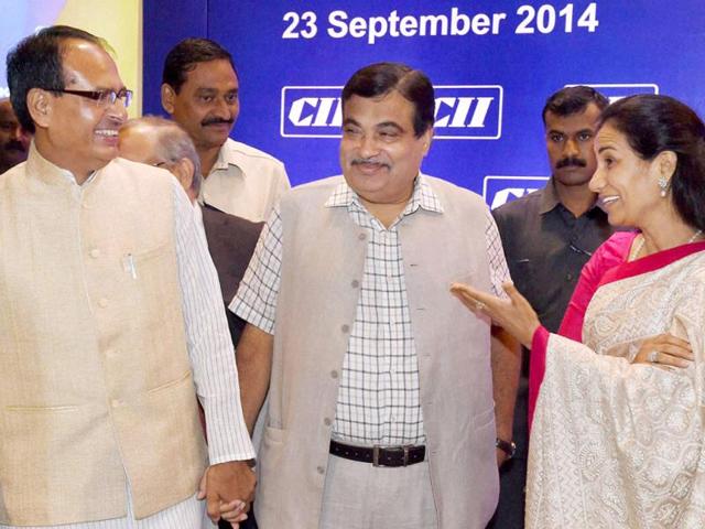 Union transport minister Nitin Gadkari, MP CM Shivraj Singh Chouhan and Chanda Kochhar, MD of ICICI Bank during CII National Council Meeting in Mumbai on Tuesday. (PTI photo)