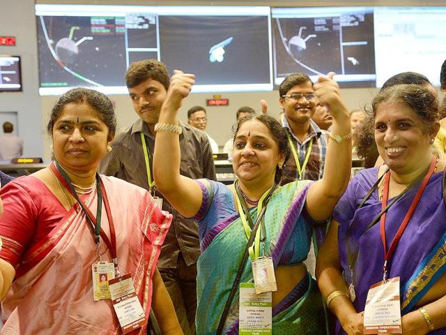 Indian-staff-from-the-Indian-Space-Research-Organisation-ISRO-celebrate-after-the-Mars-Orbiter-Spacecraft-MoM-successfully-entered-the-Mars-orbit-at-the-ISRO-Telemetry-Tracking-and-Command-Network-ISTRAC-in-Bangalore-AFP-Photo Indian-staff-from-the-Indian-Space-Research-Organisation-ISRO-celebrate-after-the-Mars-Orbiter-Spacecraft-MoM-successfully-entered-the-Mars-orbit-at-the-ISRO-Telemetry-Tracking-and-Command-Network-ISTRAC-in-Bangalore-AFP-Photo