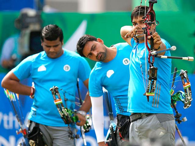 India-s-Abhishek-Verma-shoots-as-teammates-Sandeep-Kumar-and-Rajat-Chauhan-watch-during-their-men-s-compound-team-gold-medal-archery-match-against-South-Korea-Reuters-Photo