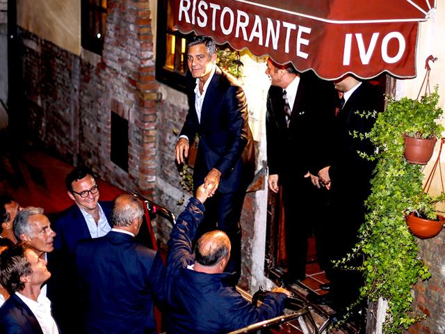 Clooney prepares to get in a boat in the stunning town of Venice. (AFP Photo) 