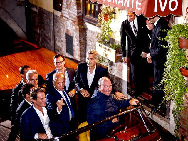 George Clooney as he leaves the restaurant Da Ivo with friends and his father during his stag night event in Venice on September 27. 