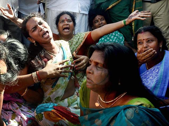 Supporters of AIADMK supremo J Jayalalithaa cry in Chennai after a Bangalore special court convicted her in a disproportionate assets case. (PTI Photo)