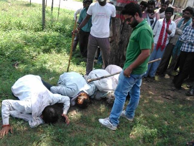 Surendra-Singh-Rajpurohit-alias-Tiger-forcing-villagers-to-bow-their-heads-before-him-in-Harda-HT-file-photo