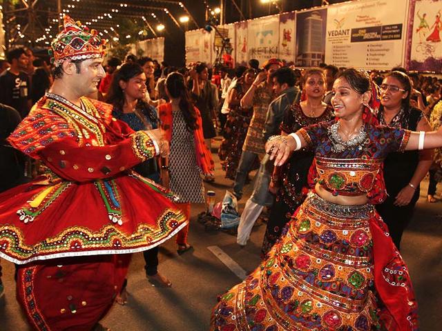 People play garba during Navratri festival at Sankalp Dandiya in Thane. (Praful Gangurde/HT photo)