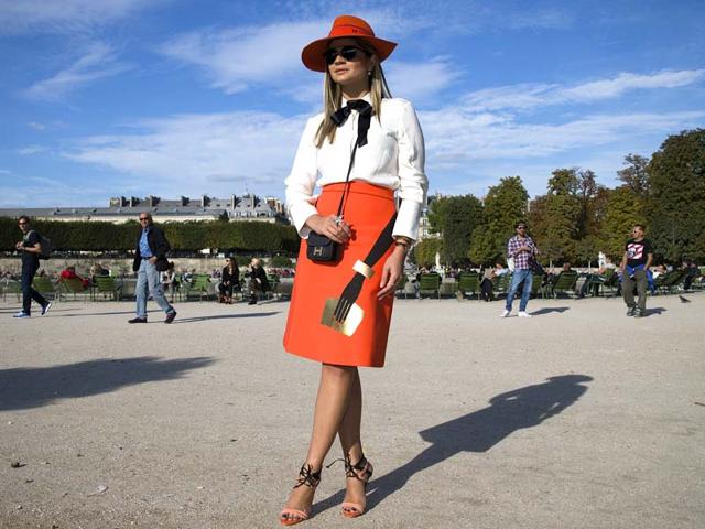 Scarlet: This fashionista matched her bright hat to her Fall/Winter 2014 skirt by Osman and rocked a YSL-style bow. Scarlet: This fashionista matched her bright hat to her Fall/Winter 2014 skirt by Osman and rocked a YSL-style bow.