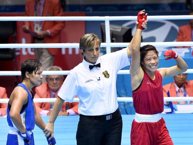 Mary Kom is declared winner in the final bout of women's flyweight boxing at the Asian Games in Incheon. (PTI Photo) Mary Kom is declared winner in the final bout of women's flyweight boxing at the Asian Games in Incheon. (PTI Photo)