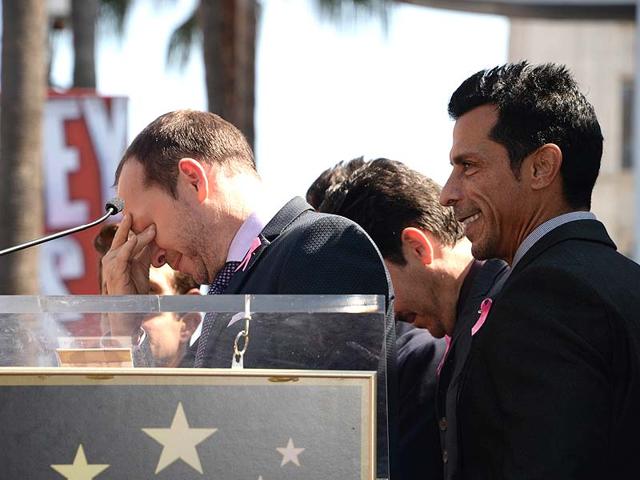 Donnie Wahlberg pauses as he becomes emotional while speaking to fans at a ceremony. (AFP Photo) Donnie Wahlberg pauses as he becomes emotional while speaking to fans at a ceremony. (AFP Photo)