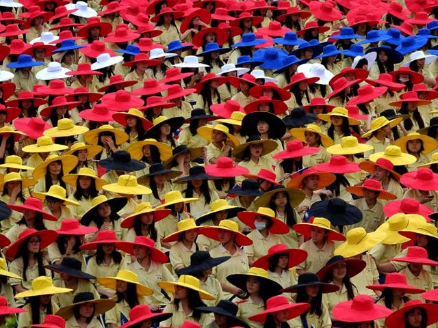 Students wear colorful hats during the national day anniversary in front of the Presidential Palace in Taipei. (AFP Photo) 