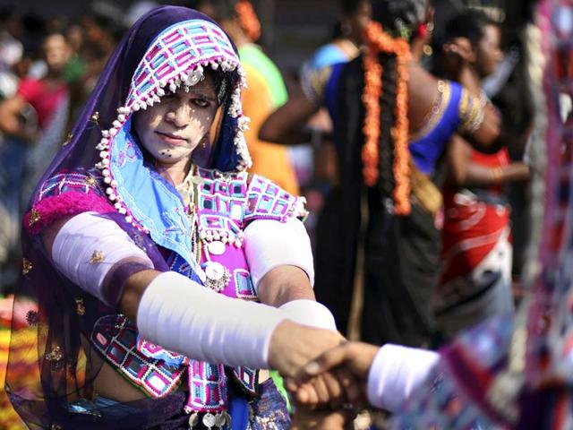 A member of Telangana Hijra Intersex Transgender Samiti (THITS), dressed in traditional clothing, performs during a protest in Hyderabad. (AP Photo) 