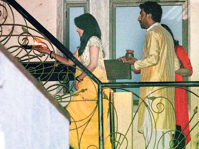 We spy Aishwarya and Abhishek Bachchan as they head to a terrace to see a full moon. (HT photo/Yogen Shah)