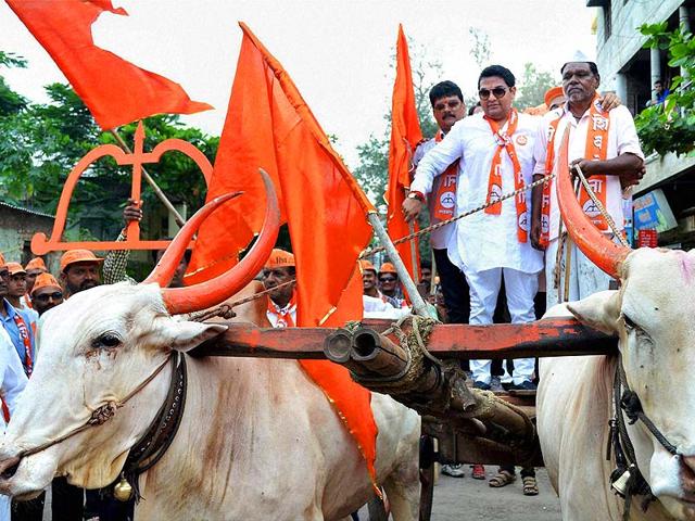 Shiv Sena Karad South candidate Ajeenkya Patil with his supporters during an election rally. (PTI Photo)