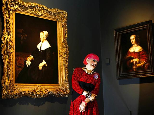 British fashion designer Zandra Rhodes is pictured in front of a painting (L) entitled Portrait of Catrina Hooghsaet by Dutch artist Rembrandt, during a photocall in the National Gallery in London, on October 14, 2014. The painting is a part of an exhibition entitled Rembrandt: The Late Works, which explores the artist's final years of painting. (AFP) British fashion designer Zandra Rhodes is pictured in front of a painting (L) entitled Portrait of Catrina Hooghsaet by Dutch artist Rembrandt, during a photocall in the National Gallery in London, on October 14, 2014. The painting is a part of an exhibition entitled Rembrandt: The Late Works, which explores the artist's final years of painting. (AFP)