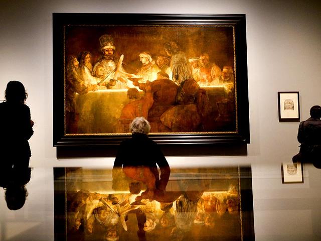 People look at Rembrandt's painting The Conspiracy of the Batavians under Claudius Civilis, about 1661-2 during a media event at The National Gallery in London on October 14, 2014. The National Gallery will be holding an exhibition entitled Rembrant: The Late Works which runs from October 15 until January 18, 2015. (AP) People look at Rembrandt's painting The Conspiracy of the Batavians under Claudius Civilis, about 1661-2 during a media event at The National Gallery in London on October 14, 2014. The National Gallery will be holding an exhibition entitled Rembrant: The Late Works which runs from October 15 until January 18, 2015. (AP)