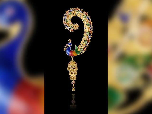Peacock-shaped earcuff and jhumka in 22ct gold with enamel work. Price on request. Available at Om Jewellers, Mumbai.