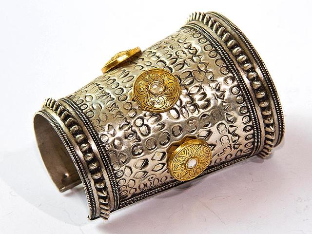 Royal Tribe handcuff fuses royal and tribal styles in sterling silver with 22ct gold discs and rosecut quartz polki in kundan setting. From Apala by Sumit, available at Hauz Khas Village and DLF Galleria, Gurgaon. Price: Rs 32,500