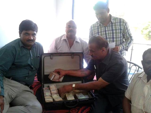 Lokayukta-officials-prepare-an-inventory-of-items-seized-during-the-raid-at-assistant-excise-commissioner-Naval-Singh-Jamod-s-residence-in-Indore-on-Friday-HT-photo