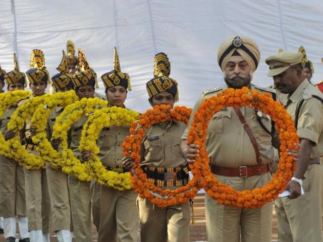 Police personnel observe Police Martyr's Day at Lal Parade Ground in Bhopal on Tuesday. (Praveen Bajpai/HT photo)