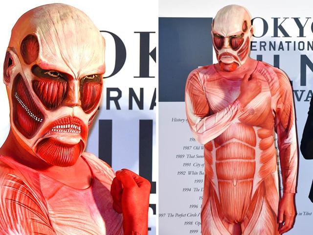 Japan's animation character Attack on Titan poses on the red carpet for the 27th Tokyo International Film Festival opening ceremony in Tokyo on October 23, 2014. The Tokyo International Film Festival opens on October 23 with its focus heavily on Japanese animated movies and with cult superhero Ultraman set to swoosh down the red carpet with Prime Minister Shinzo Abe. (AFP) 