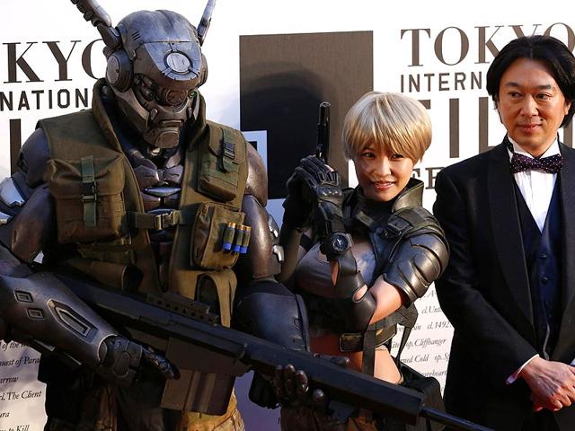 Characters of Japanese animation APPLESEED ALPHA pose for photography during the opening event of the Tokyo International Film Festival in Tokyo October 23, 2014. (Reuters) 