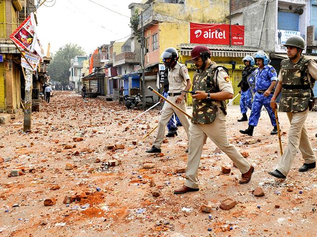 Policemen-patrol-a-road-in-Trilokpuri-New-Delhi-Mohd-Zakir-HT-Photo