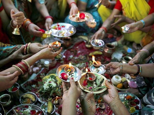 Hindu devotees offers prayers after taking a holy dip in the River Yamuna during the auspicious month of Kartik in Allahabad, India. (AP Photo)