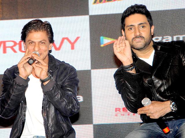 Shah Rukh Khan and Abhishek Bachchan attend a promotional event for the mobile game of Hindi film "Happy New Year" in Mumbai on October 27, 2014. (AFP Photo) Shah Rukh Khan and Abhishek Bachchan attend a promotional event for the mobile game of Hindi film "Happy New Year" in Mumbai on October 27, 2014. (AFP Photo)