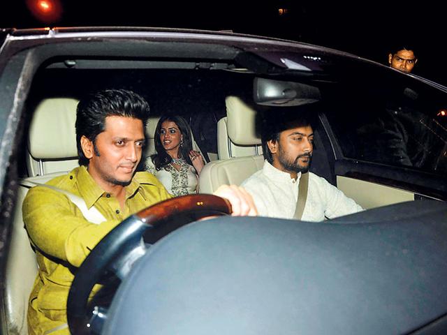 Riteish Deshmukh drives his car with wife Genelia.