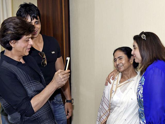 Shah Rukh Khan clicks photograph of West Bengal CM Mamata Banerjee and Farah Khan at CM Office in Kolkata. (Photo: PTI) 